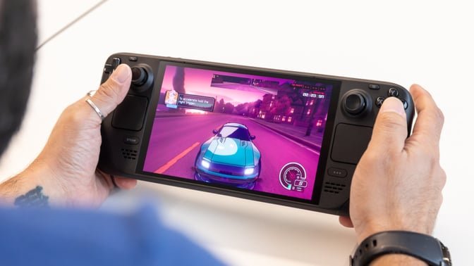 steam deck oled held in hand